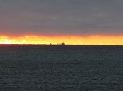 Red skies in the morning...  Capt. Henry Jackman up-bound to Stoneport after spending time at anchor in Tawas Bay.