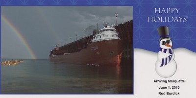 Reactivated for 2010, steamer Kaye E. Barker arriving at the Upper Harbor, Marquette, under a double rainbow
