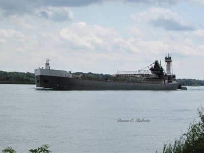 Tug Victory and barge Maumee (Sault Ste Marie) sounded a salute opposite Stag Island.