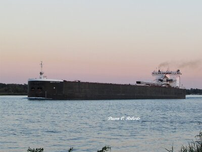 American Century (Superior) in the rosy glow of sunset, off Stag Island.