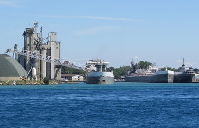 This was the scene at the Sarnia Government Dock.  Manitoulin was unloading grain while tug Olive Moore with her barge, Louis J. Kuber and Ojibway sat in temporary lay-up.
