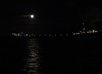 Lee A. Tregurtha crosses the beam of an awesome Harvest Moon as she heads up-bound to Marquette, in ballast.