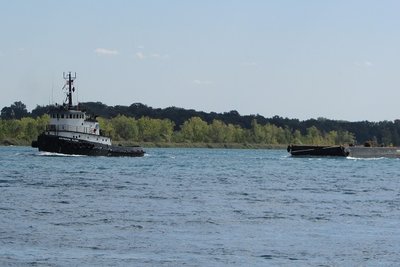 Tug Candace Elise and barge moving up river to Escanaba.
