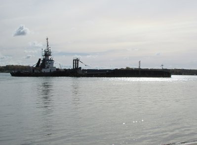 Tug Leonard M was a silhouette moving down river to Detroit.