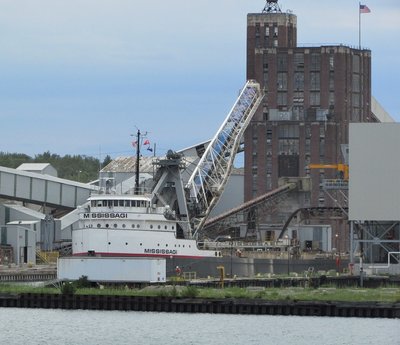 If you look closely, you can see the stone product flowing into her cargo hold.