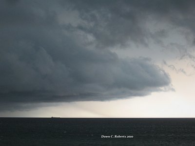 I've taken many pictures of her on the St. Clair River, but this remains my favorite, off Lexington.  On land, tornado sirens were screaming but, once the storm passed, I drove to the Bluewater Bridges, just to learn what ship it was.