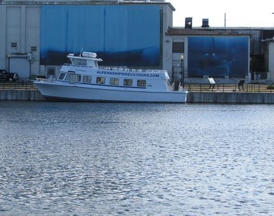 Glass-bottom boat back at its dock by the Great Lakes Maritime Heritage Center.