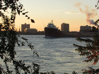 Lee A Tregurtha approaching the Bluewater Bridges with the sun coloring her trailing plume. Destination Two Harbors.