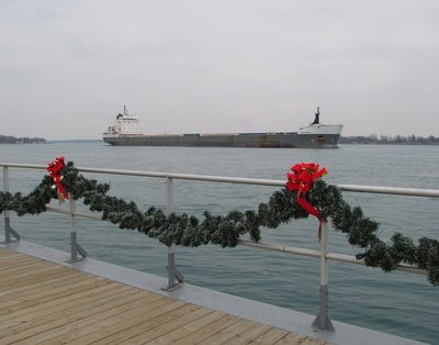 Kaministiqua (Sorel) passing festive Riverwalk decorations at St. Clair.