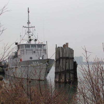 Cadet training vessel Grayfox, sits at her dock, under dense morning skies.