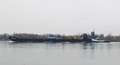 Karen Andrie (Indiana Harbor) pushing barge Endeavor.  Note the undulating water as it passes from bow to stern.