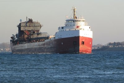 CSL Frontenac (from Milwaukee to Windsor) reflecting the early morning sun off her pilot house and bow.