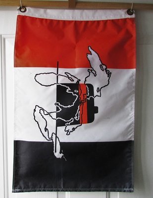 This flies above my sun porch entry, but during the height of gale-force winds this week, it literally took flight!