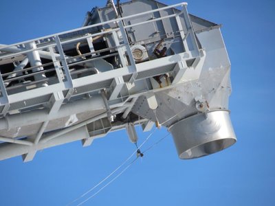 Unloading spout on the end the boom.