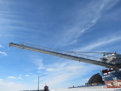 Unloading boom swung out to allow loading.