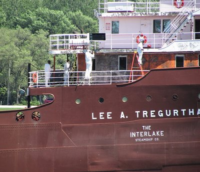 Crew repainting classic freighter Lee A Tregurtha's pilot house as she passed on her way to Toledo/TORCO.