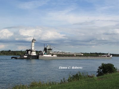 Tug Victory and barge Maumee (Toledo) sounded a salute as they neared Stag Island.