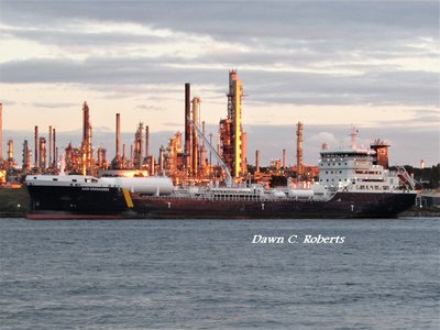 Tanker Gaia Desgagnes at the lower Sarnia Fuel Dock as the setting sun illuminates the facility.