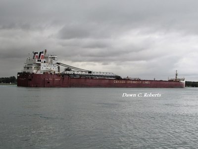 The Hon. Paul J. Martin (Quebec) staying ahead of fast moving rains.