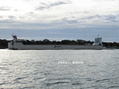 Tug Samuel de Champlain and barge Innovation (Alpena) pass north of Marysville as potential rain clouds move on to the east.