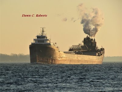 Setting sun and haze makes this photo of Lee A. Tregurtha (Marquette) look like an old sepia print.