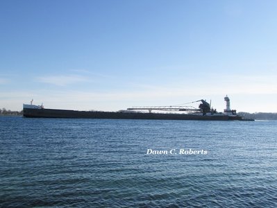 Tug Victory and barge Maumee (Marquette) dividing an exceptionally blue sky and water.