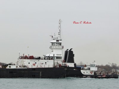 Tug Michigan pushing Great Lakes to Charlevoix.