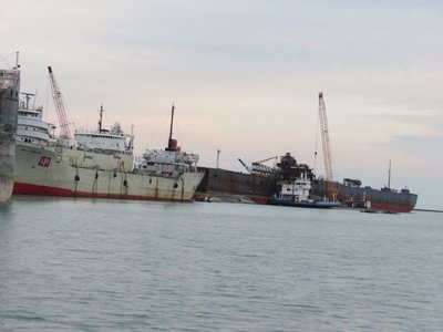 Paul H. Townsend with the English River, Algoway, and Algorail at International Marine Salvage scrapyard in Port Colborne, Ontario. Algoma Transport's bow is visible on the left side of the photo.