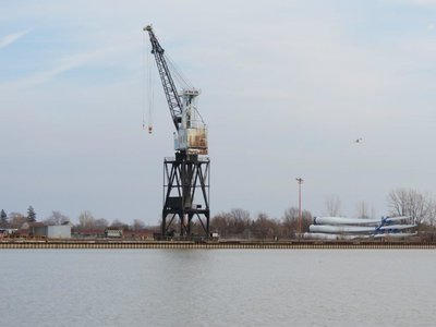Crane at Wharf 52, Heddle Port Weller, Ontario Shipyard. Some windmill blades are being stored to the right of the crane.