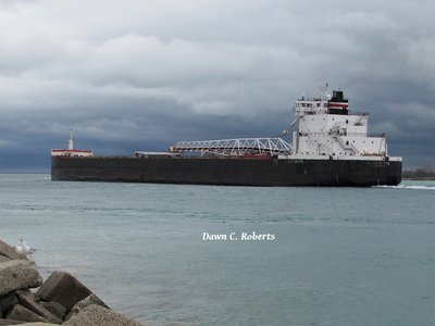 H. Lee White (Calcite) enters Lake Huron with stormy skies looming overhead.