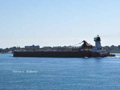 Tug Joyce L. VanEnkevort (Stoneport) pushes barge Great Lakes Trader through Chemical Valley. She was the first "modern" tug my late son and I ever saw (Huron, OH 2004) and we always referred to the design as "ET."