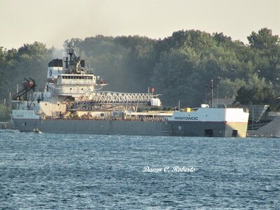 Manitowoc caught me by surprise as I watched her slow at Marysville and shift toward the Bluewater Aggregates dock. Drove on up river to get this shot. Note the work boat near her stern.
