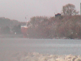 Munson docked behind