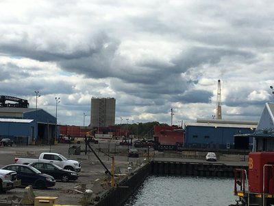 A salty in port. Containers are piled up. Busy day for a Saturday. Lots of movement.