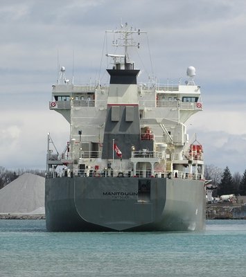 Originally down-bound, Manitoulin blocks the St. Clair River as she makes a turn back up river and moves to a Sarnia dock.