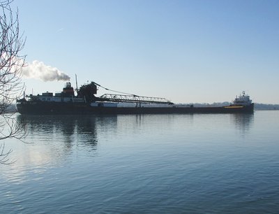 Hon. James L. Oberstar reflected in the river.