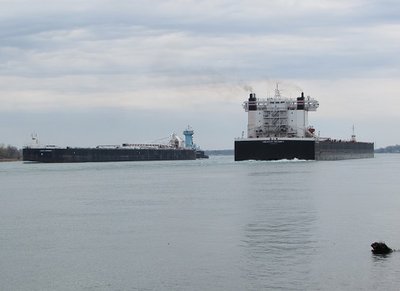 2016-05-07c Boothe & AmInteg..jpg (69.26 KiB) Viewed 2116 times Up-bound Ken Boothe, Sr. and barge Lakes Contender (Stoneport) and down-bound American Integrity (St. Clair Power Plant) meet on a curve in the river.
